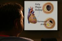 Surgeon showing me an illustration of a narrowed artery