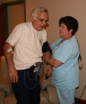 Nurse taking blood pressure prior to stress test