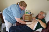 Elaine Blessing my Gentiva nurse examines my incision