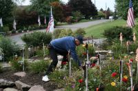 Bill placing a rose