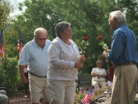 Ralph and Dottie placing their rose