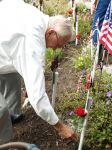 John placing his rose