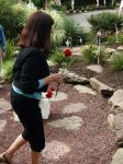 Pat placing her rose