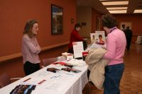 Kim Kindler greets a participant