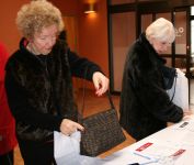 Two friends, Marie and Marilyn, registering
