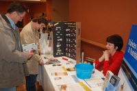 Arlene Feleccia greets two participants