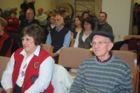 Luann and Bill listening to a our presentation