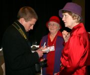 Local Reporter Interviewing Red Hat Ladies